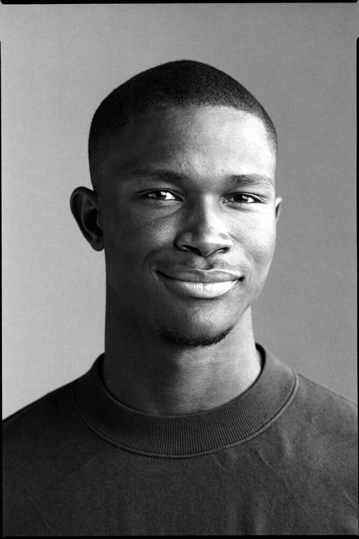 Black and white portrait of a man in his late twenties